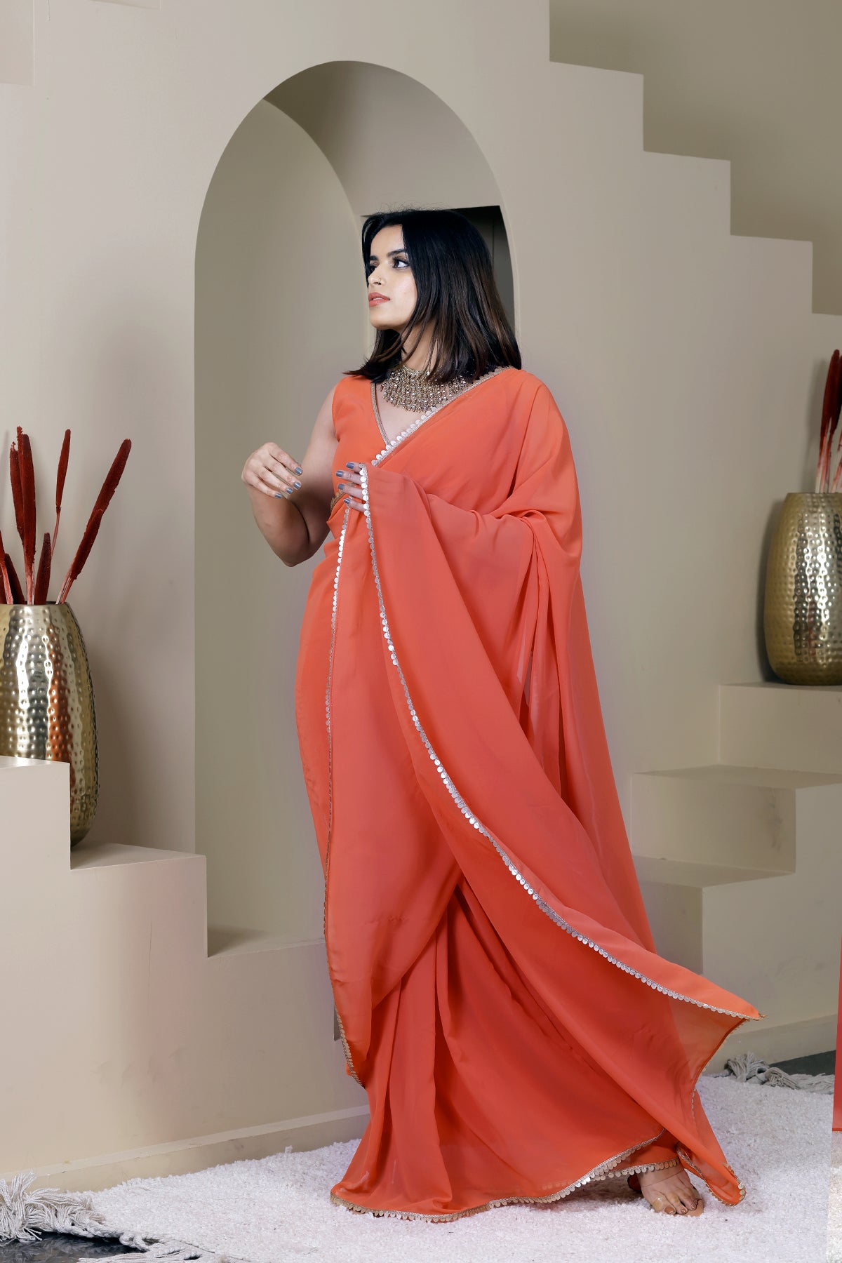 Suhani Orange Georgette Saree
