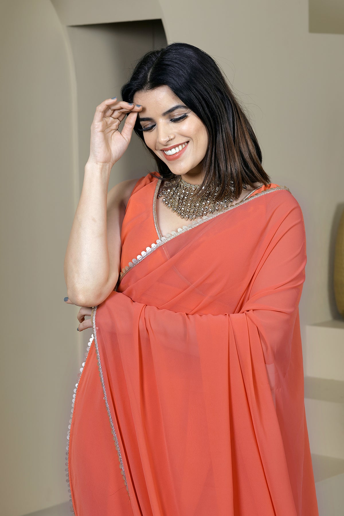Suhani Orange Georgette Saree